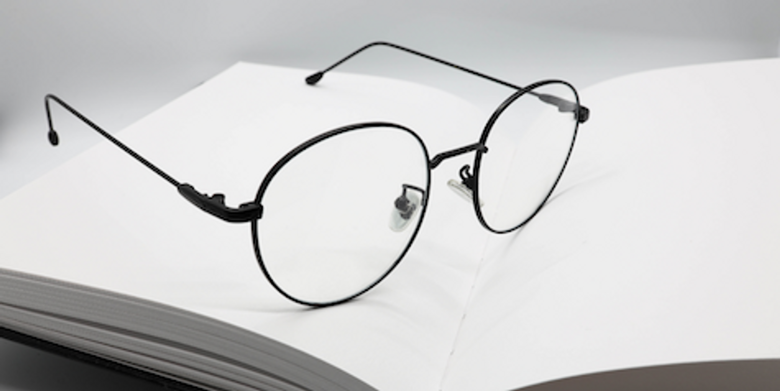 Glasses on top of a book